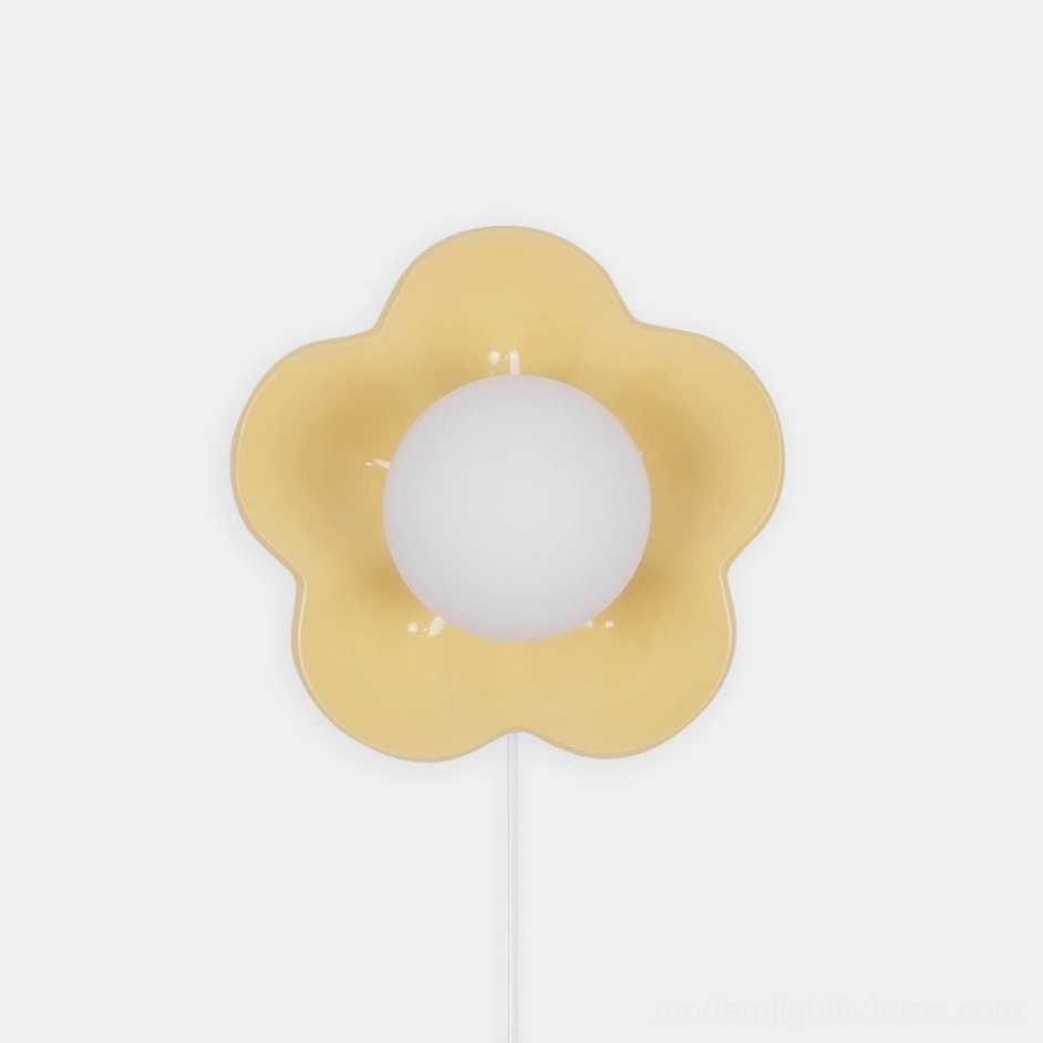 Yellow flower wall sconce with white frosted glass shade, front view plug-in lamp design