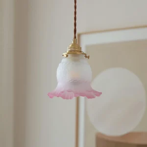 Yellow glass bell pendant lamp hanging in modern living room interior with wall decor