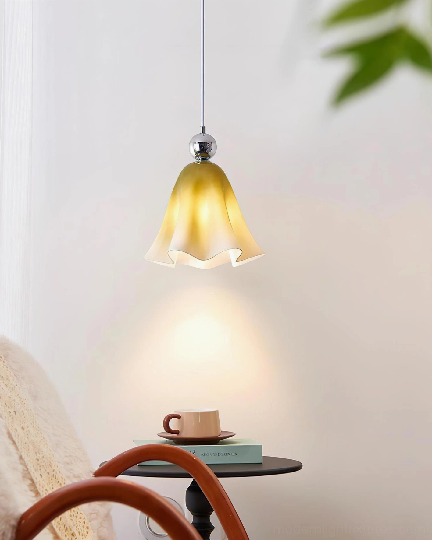 Vellia pendant light warm yellow gradient glass shade cozy living corner ambiance scene