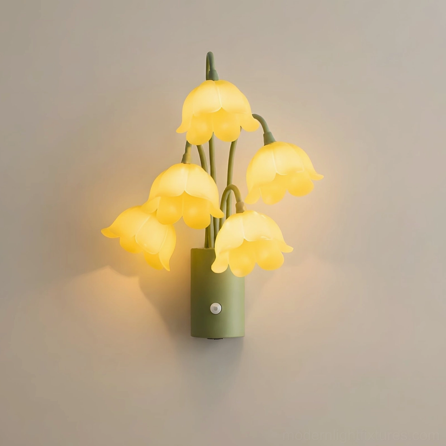 Yellow lily-of-the-valley motion-sensor wall sconce with cheerful golden bell-flower shades on green iron frame, studio presentation