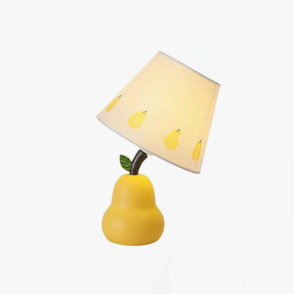Yellow pear-shaped table lamp with botanical pattern fabric shade in studio lighting