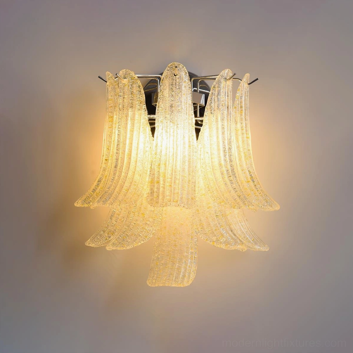 Yellow petal glass wall sconce creating warm ambient illumination with Venetian-inspired artistic glass design