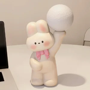 Yellow and pink rabbit table lamp displayed on home office desk - contemporary desk lamp with integrated LED