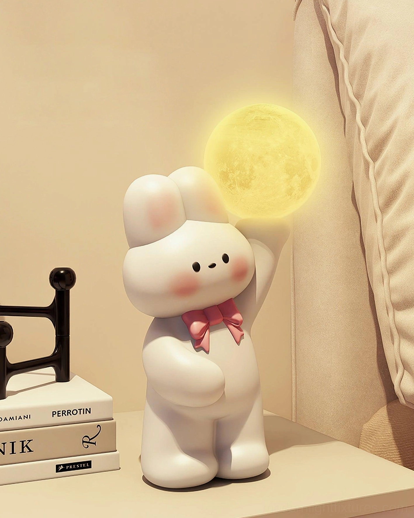 Warm yellow rabbit bedside lamp with pink bow glowing on bedroom nightstand - cozy ambient lighting