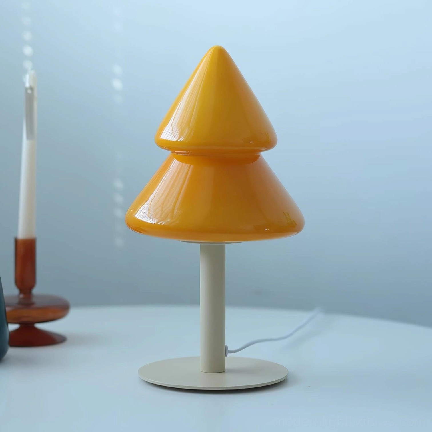 Yellow and beige Christmas tree lamp variant on neutral background studio lighting