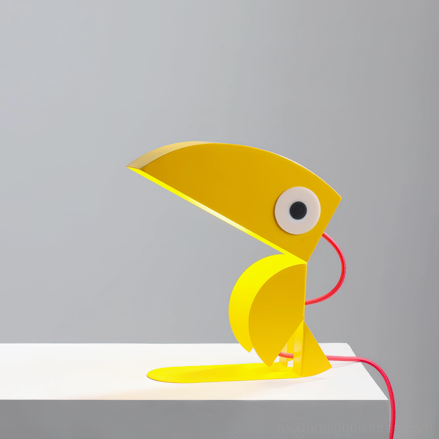 Yellow toucan table lamp close-up showing craftsmanship and charming character details