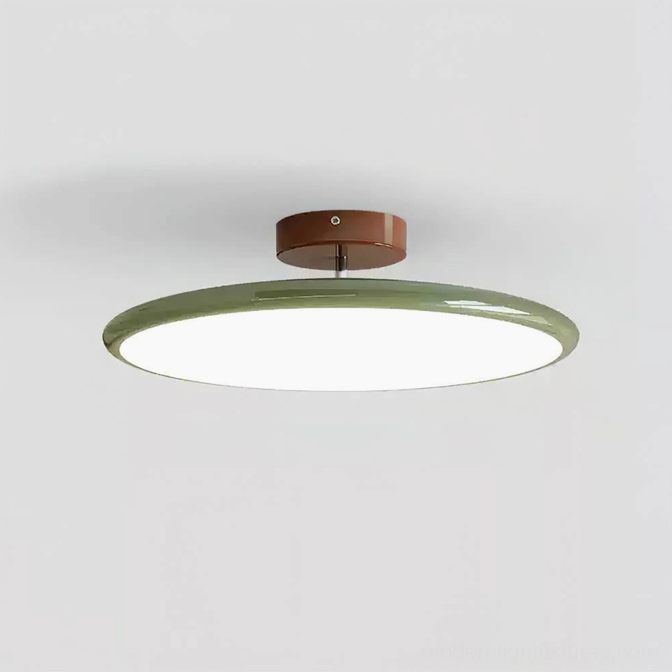 Zayn 50cm large ceiling light with sage green disc showing warm ambient lighting in open-plan living room