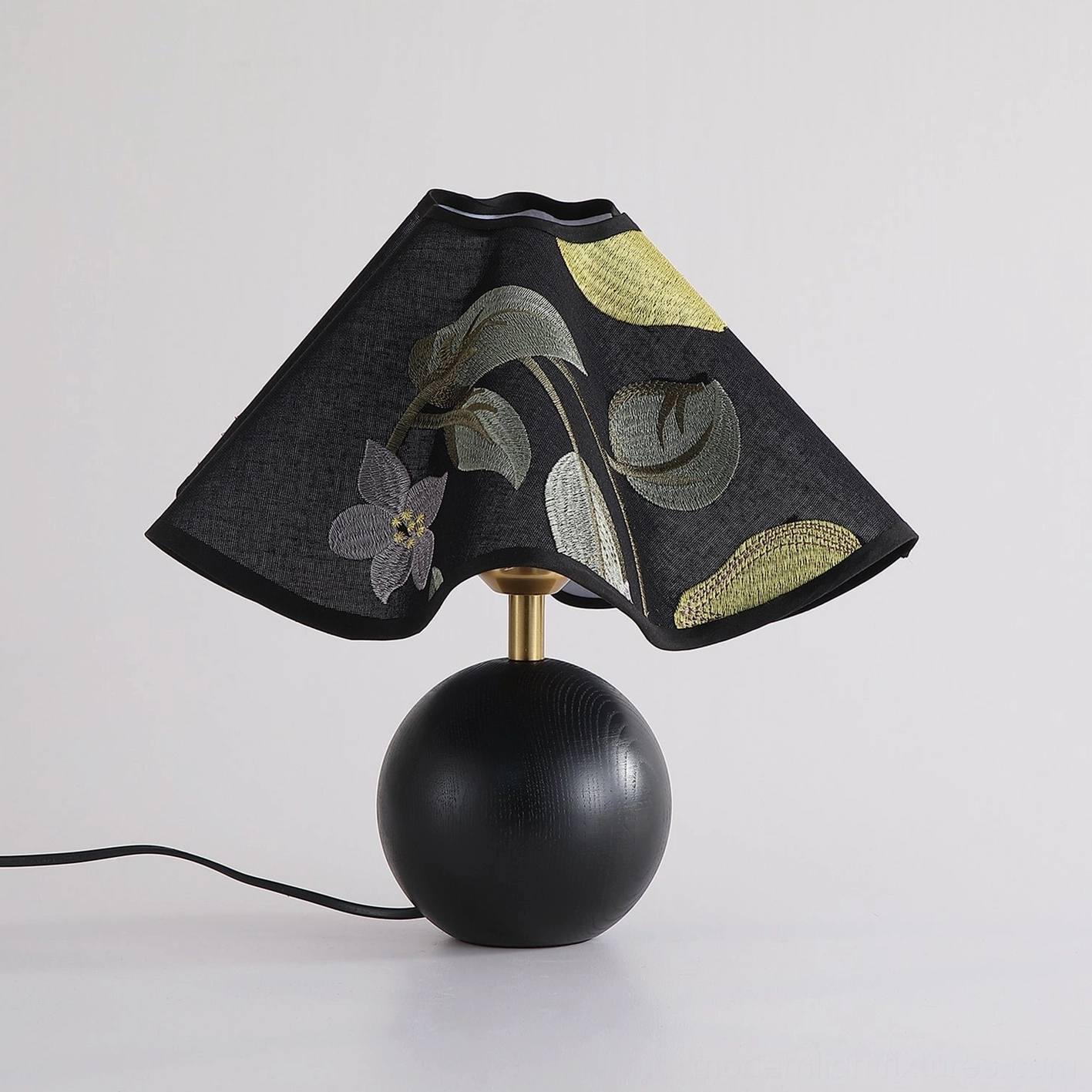 Zerina table lamp black variant with embroidered shade frontal studio display view