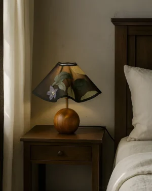 Zerina table lamp with warm ambient lighting in bedroom bedside scene creating intimate atmosphere