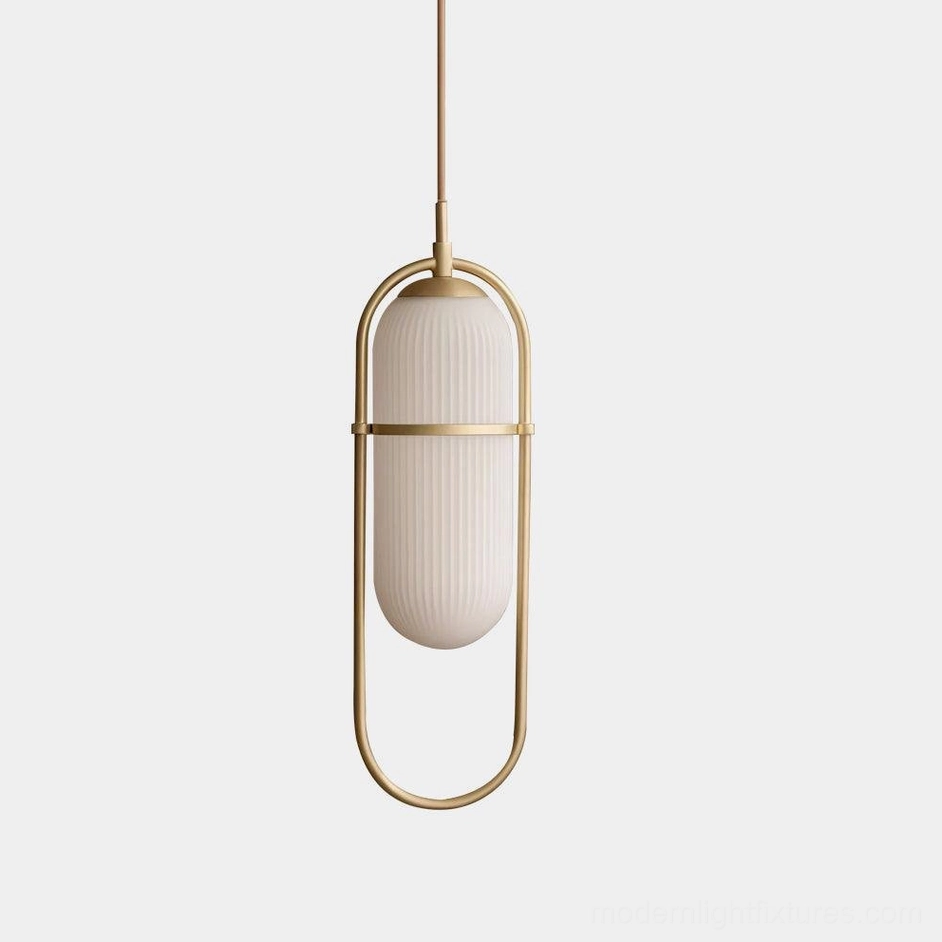 Zesta modern pendant light with brass gold metal frame and ribbed frosted glass shade, front overhead studio view