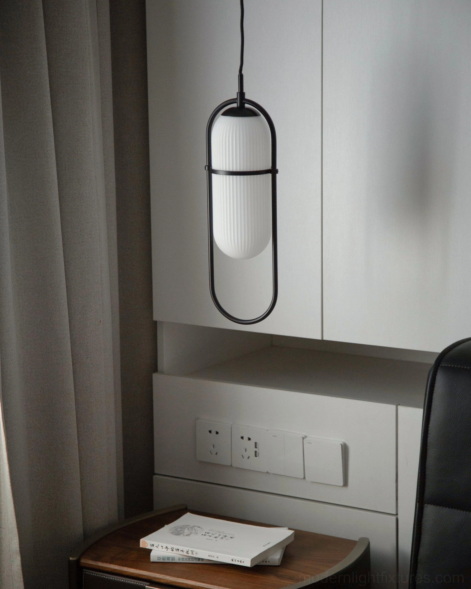 Close-up detail view of Zesta pendant light ribbed glass shade and metal frame construction