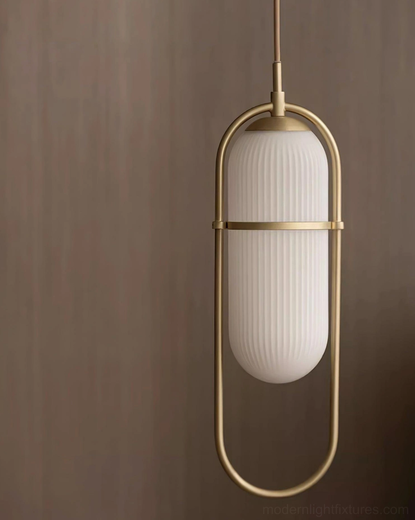 Zesta modern pendant lamp with integrated LED technology mounted on sloped ceiling configuration