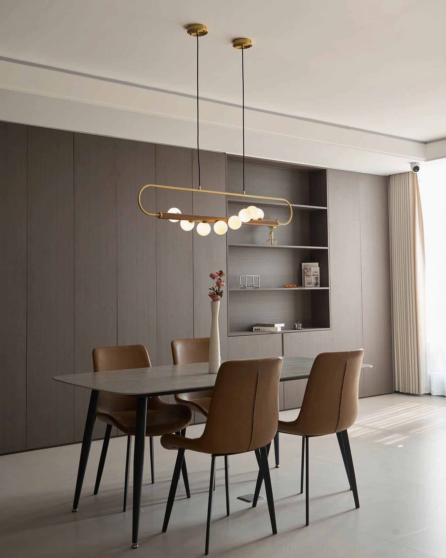 Zeta Linear Chandelier angle shot showing walnut wood texture, brass patina, and glass globe saturation under warm lighting