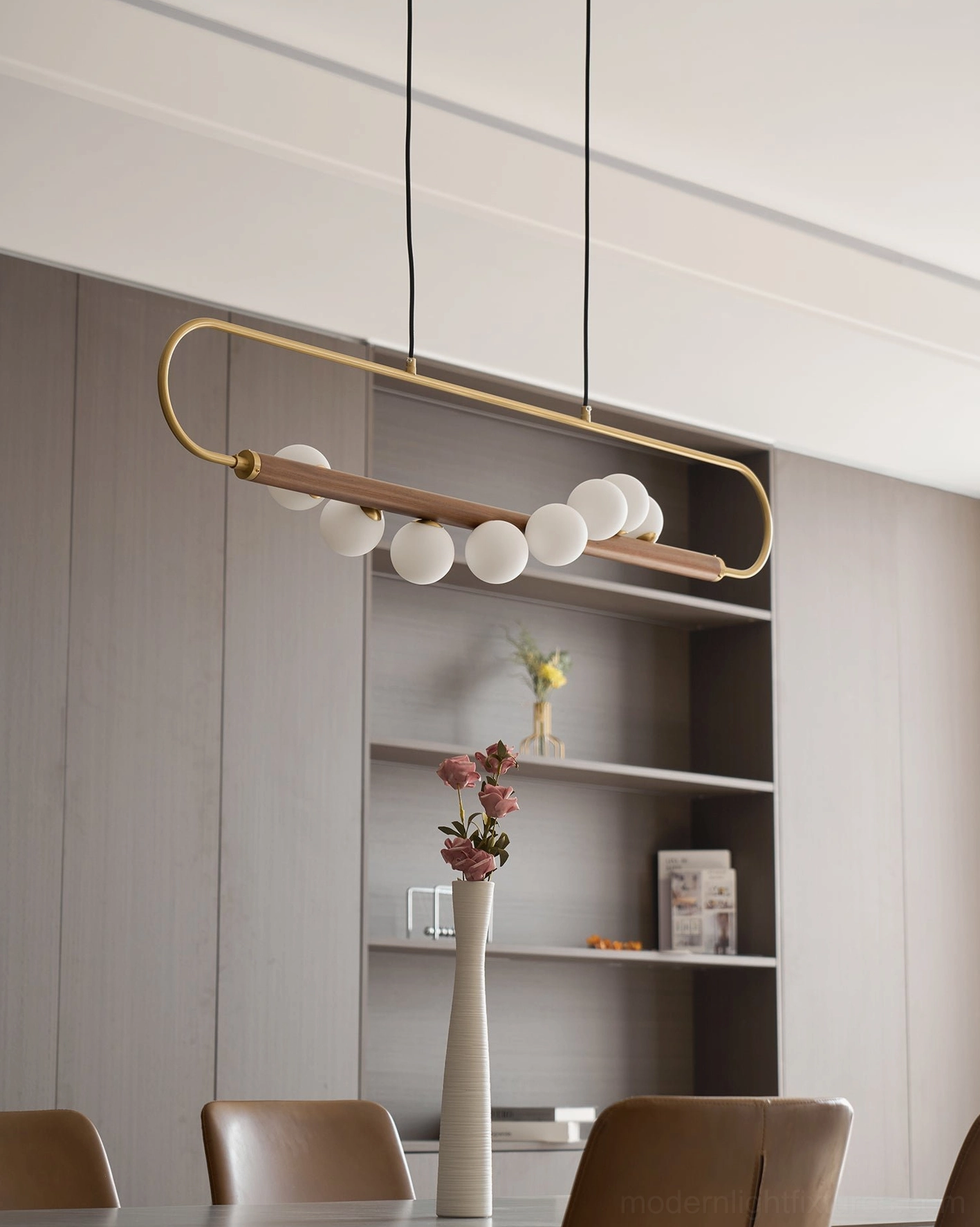 Zeta Linear Chandelier installed above family dining room table highlighting warm light distribution across multiple place settings