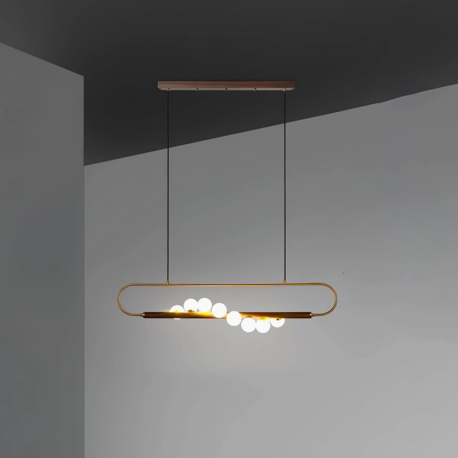 Zeta Linear Pendant Lamp showing warm color temperature and ambient glow creating dining atmosphere and table visibility