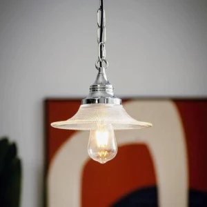 Zowie retro pendant lamp close-up showing polished chrome fixture and warm glowing Edison bulb with ribbed glass shade